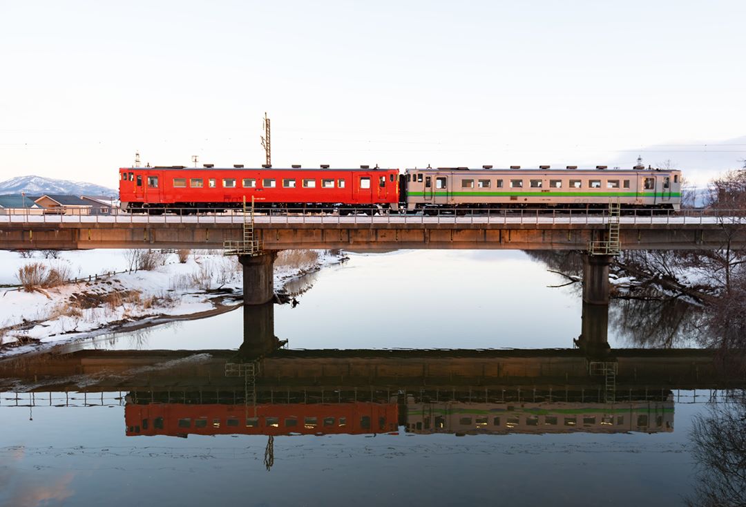 Image of train reflected in water