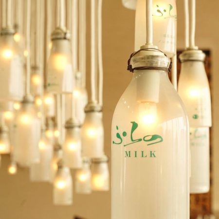 Milk-bottle lamp at hotel in Furano