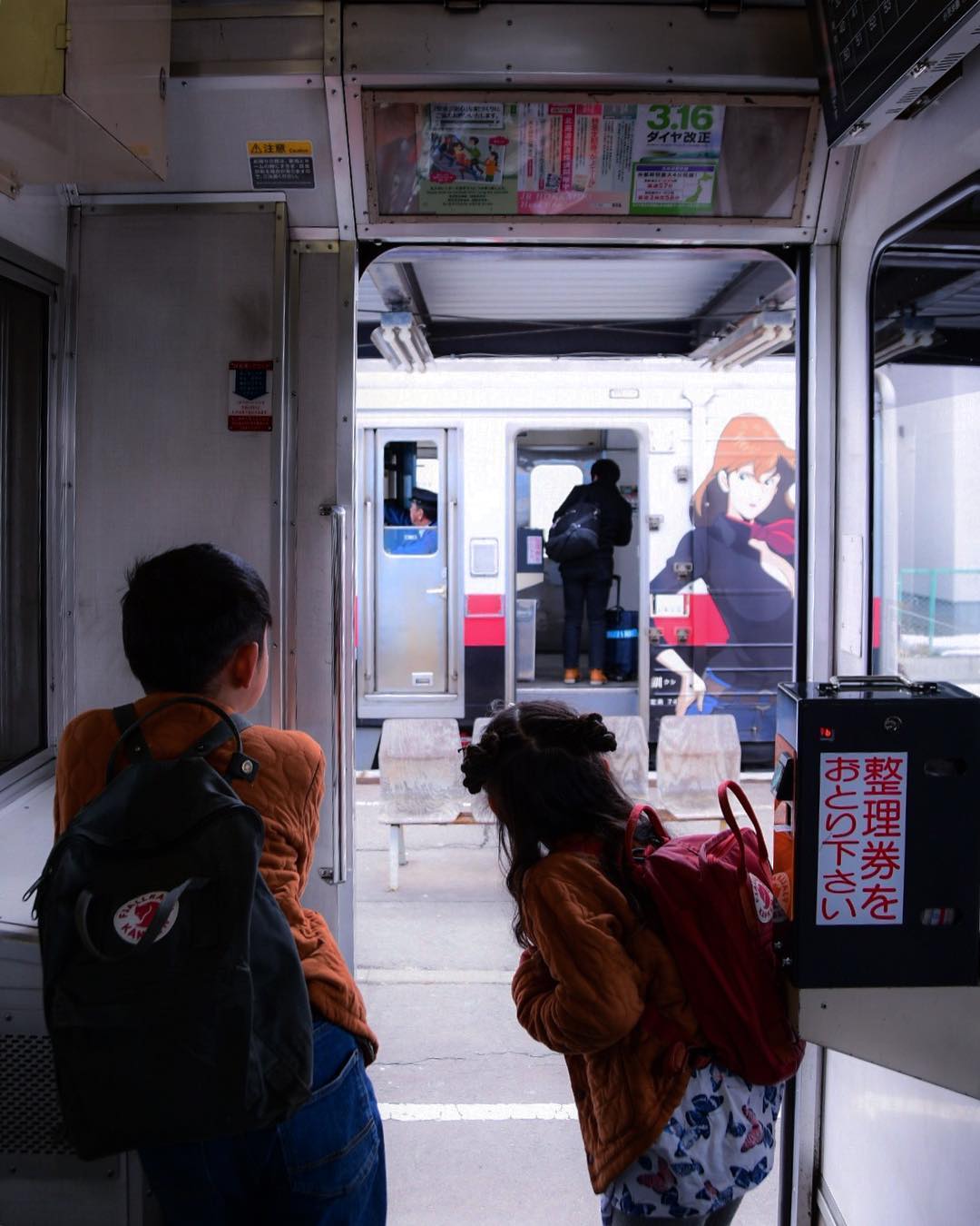 Children looking at outside of train