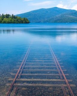 Railroad track leading to the bottom of the lake